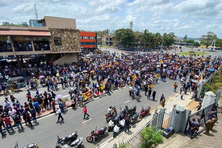 Protesters participate in an anti-government demonstration outside the Galle International Cricket Stadium during the second day play of the second cricket Test match between Sri Lanka and Australia in Galle on Saturday. — AFP