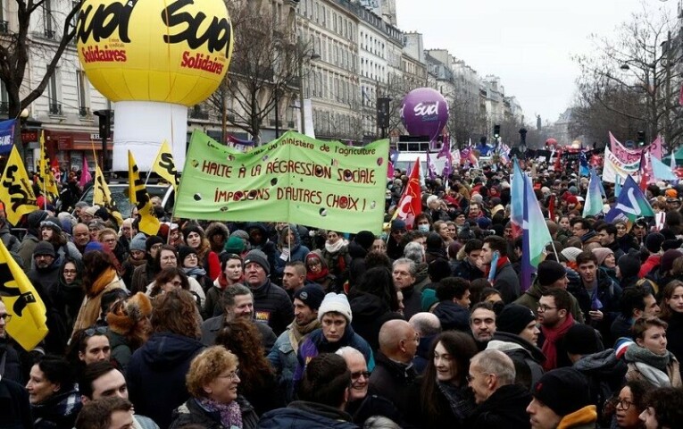 Protesters attend a demonstration against French government’s pension reform plan in Paris as part of a day of national strike and protests in France on Thursday. — Reuters