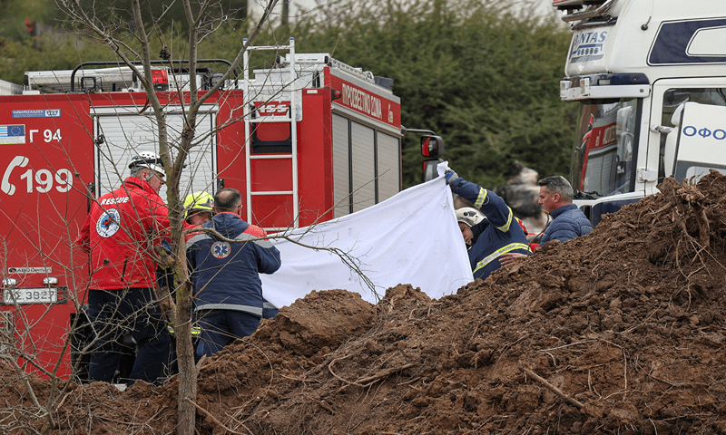 Rescuers operate at the site of a crash, where two trains collided, near the city of Larissa, Greece, March 1, 2023.—Reuters/Alexandros Avramidis